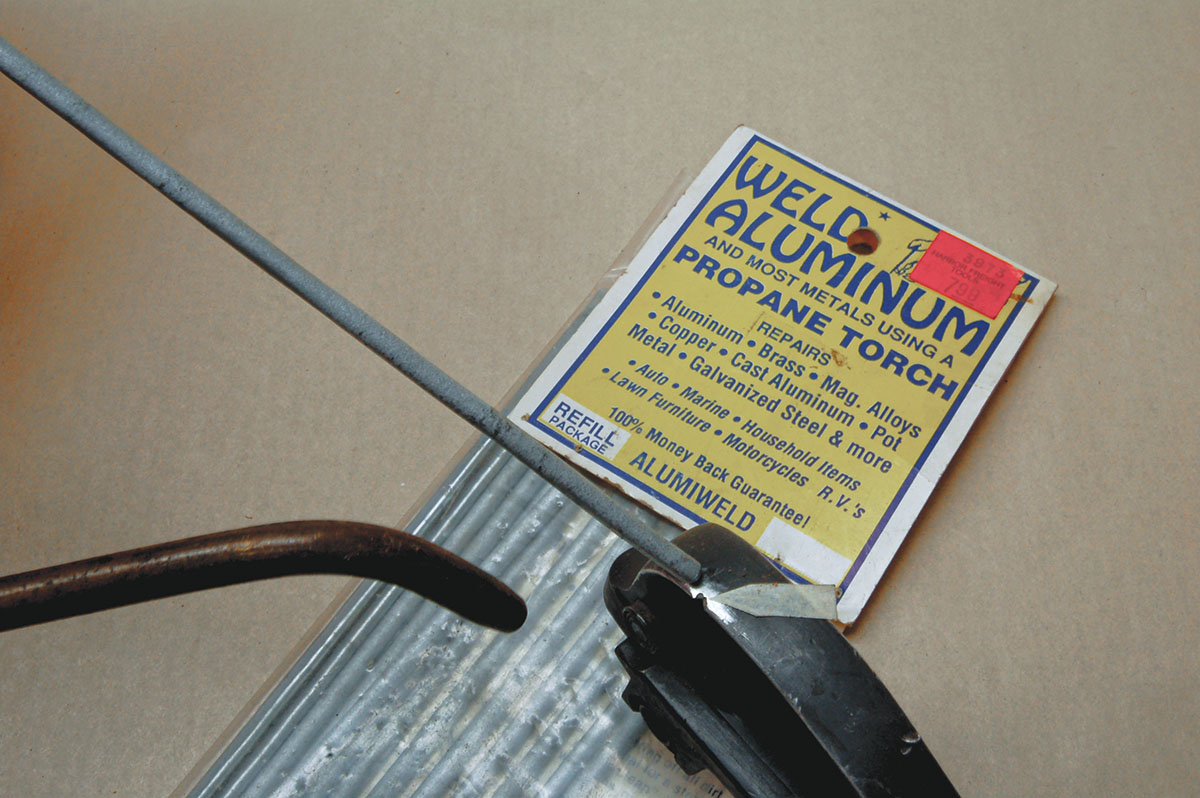 Some newer “old .22s” have aluminum trigger guards and frames. Damage from abuse (see arrow) can be repaired using product shown.